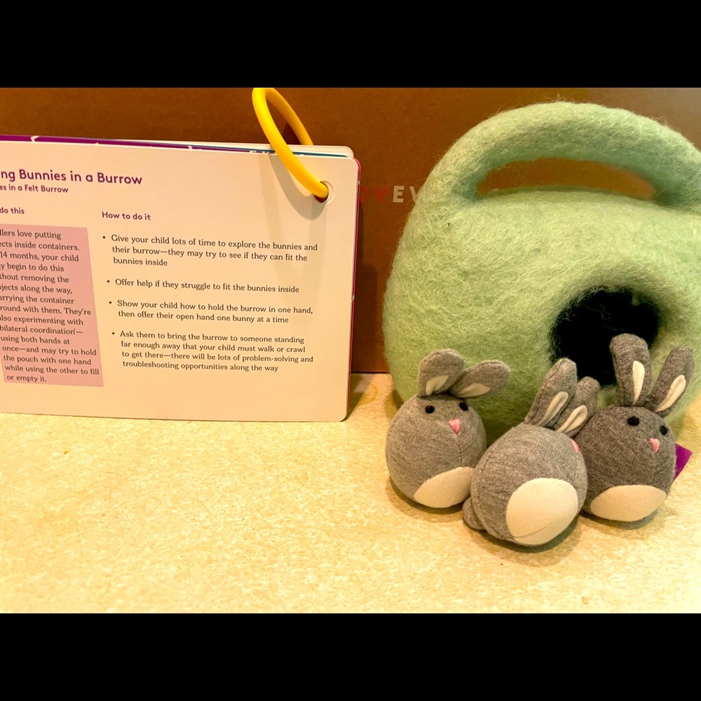 Lovevery bunnies in a felt burrow